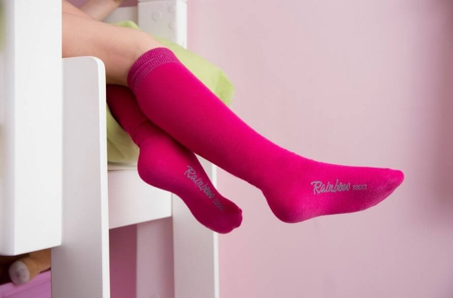 Girl wearing pink cotton knee-high socks